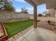 Artificial turf backyard with block wall and patio at 1559 Wild Willey Way, Henderson, NV 89002