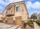 Two-story townhome with attached garage and balcony at 1559 Wild Willey Way, Henderson, NV 89002