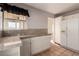 Bright eat-in kitchen features white cabinetry and tile countertops at 1950 Turtlerock St, Las Vegas, NV 89142