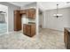 View of kitchen with granite countertops and wood cabinets at 2653 Rue Montpellier Ave, Henderson, NV 89044