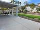 Covered patio, artificial turf, and a stone retaining wall at 3049 Azure Bay St, Las Vegas, NV 89117