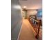 Upstairs hallway with a chandelier and wooden railing at 3049 Azure Bay St, Las Vegas, NV 89117