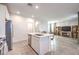 Modern kitchen with island, stainless steel appliances, and white cabinetry at 3304 Viola Hills Ave, Henderson, NV 89044