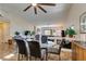 Dining area with glass-top table and four chairs, near kitchen at 3816 Sunking St, Las Vegas, NV 89130