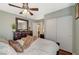 Guest bedroom with dresser, ceiling fan and sliding door closet at 5024 Glittering Star Ct, Las Vegas, NV 89130