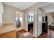 Bright hallway with wood floors, leading to bedrooms and laundry at 5024 Glittering Star Ct, Las Vegas, NV 89130