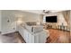 Bright living room featuring a sectional sofa and hardwood floors at 5024 Glittering Star Ct, Las Vegas, NV 89130