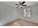 Bedroom with window, ceiling fan, and wood-look floors at 632 Tonin Ave, North Las Vegas, NV 89031