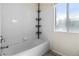 Bathroom with a shower/tub combo and white tile at 700 Carnegie St # 4812, Henderson, NV 89052