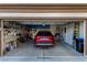 Garage with room for one car and storage shelves at 7927 Crested Starling Ct, North Las Vegas, NV 89084