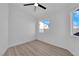 Bright bedroom with wood-look floors and ceiling fan at 8221 Ten Gallon Ct, Las Vegas, NV 89129