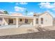 Covered patio with ceiling fan and access to backyard at 8221 Ten Gallon Ct, Las Vegas, NV 89129