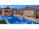 Relaxing pool and spa area with a covered patio and outdoor seating at 12127 Castilla Rain Ave, Las Vegas, NV 89138