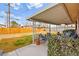 Relaxing patio with seating area and fenced backyard at 6220 Rassler Ave, Las Vegas, NV 89107