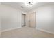 Bright bedroom with neutral walls and carpet, featuring a double door closet at 1008 Wyatt Ave, Las Vegas, NV 89106