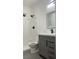 Clean bathroom with shower, toilet and gray vanity at 1417 Winwood St, Las Vegas, NV 89108