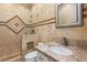 Bright bathroom with beige tile, a single sink vanity, and a shower stall at 1504 Castle Wall St, Las Vegas, NV 89117