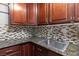 Kitchen features granite countertops and dark wood cabinets at 1504 Castle Wall St, Las Vegas, NV 89117