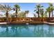 Inviting pool with a waterfall feature and lush landscaping at 1504 Castle Wall St, Las Vegas, NV 89117