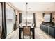 Bright dining room featuring a wood table and modern chandelier at 258 Tallis Hills Ave, Henderson, NV 89011