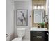 Stylish bathroom with black vanity and gold accents at 2895 Sunlit Glade Ave, Henderson, NV 89074