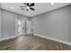 Bedroom with tile floors, ceiling fan, and exterior access at 2895 Sunlit Glade Ave, Henderson, NV 89074