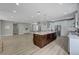 Modern kitchen with large island and white cabinets at 2895 Sunlit Glade Ave, Henderson, NV 89074