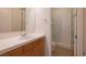 Clean bathroom with wood cabinets and a shower/tub combo at 40 Luce Del Sole # 1, Henderson, NV 89011