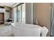 Bathroom with free-standing tub and city views at 4381 W Flamingo Rd # 5201, Las Vegas, NV 89103