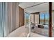 Relaxing bathroom with large tub and city views at 4381 W Flamingo Rd # 9301, Las Vegas, NV 89103