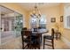 Charming breakfast nook with round table and access to the backyard at 448 Punto Vallata Dr, Henderson, NV 89011