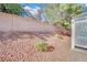 Landscaped backyard with block wall and gravel at 5125 Briar Meadow Way, Las Vegas, NV 89118