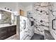 Modern bathroom with marble shower and double vanity at 56 Tatahatso Point St, Henderson, NV 89011