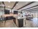 Spacious kitchen featuring dark cabinetry and an island at 56 Tatahatso Point St, Henderson, NV 89011