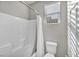 Clean bathroom with shower/tub combo and white tile at 5732 Swan Bridge St, North Las Vegas, NV 89081