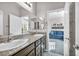 Bathroom with double vanity and view into adjacent room at 5732 Swan Bridge St, North Las Vegas, NV 89081