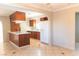 Kitchen with wood cabinets, island and white appliances at 905 N 17Th St, Las Vegas, NV 89101