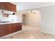 Kitchen with wood cabinets, tile floor and island at 905 N 17Th St, Las Vegas, NV 89101