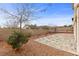 Landscaped backyard with stone patio and desert plants at 12119 High Country Ln, Las Vegas, NV 89138