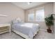 Bedroom with full-size bed and window coverings at 11431 Gravitation Dr # 102, Las Vegas, NV 89135