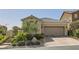 Single-story home with attractive landscaping and two-car garage at 12221 Terrace Verde Ave, Las Vegas, NV 89138