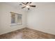 Bright bedroom with wood-look floors and ceiling fan at 1318 Springdale Ln, Mesquite, NV 89034