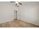 Spacious bedroom with wood-look floors, closet, and ceiling fan at 1318 Springdale Ln, Mesquite, NV 89034