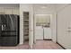 Laundry room with washer, dryer, and built-in shelving at 1318 Springdale Ln, Mesquite, NV 89034