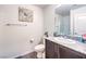 Modern bathroom with dark vanity, granite countertop and shower at 2657 Champagne Gold Ave, North Las Vegas, NV 89086