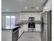 Modern kitchen with stainless steel appliances and granite countertops at 302 Vandalia St, Las Vegas, NV 89106