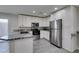 Modern kitchen with stainless steel appliances and granite countertops at 302 Vandalia St, Las Vegas, NV 89106