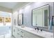 Modern bathroom with double vanity and quartz countertop at 3146 Bel Air Dr, Las Vegas, NV 89109