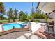 Inviting pool and spa with brick patio and golf course view at 3146 Bel Air Dr, Las Vegas, NV 89109