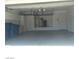 Spacious garage with storage racks and extra space at 3761 Tranquility Ridge Ct, Las Vegas, NV 89147